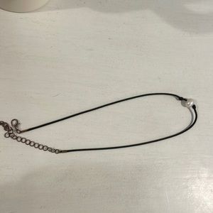 Black string with white pearl necklace
